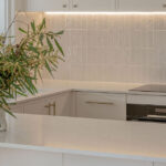 Caesarstone 5444 Lunar Frost surfaces in Ebop Building home - kitchen and bathroom