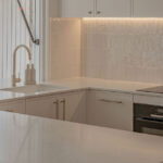 Caesarstone 5444 Lunar Frost surfaces in Ebop Building home - kitchen and bathroom