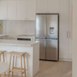 Caesarstone 5444 Lunar Frost surfaces in Ebop Building home - kitchen and bathroom
