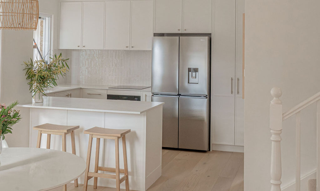 Caesarstone 5444 Lunar Frost surfaces in Ebop Building home - kitchen and bathroom