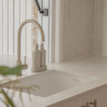 Caesarstone 5444 Lunar Frost surfaces in Ebop Building home - kitchen and bathroom